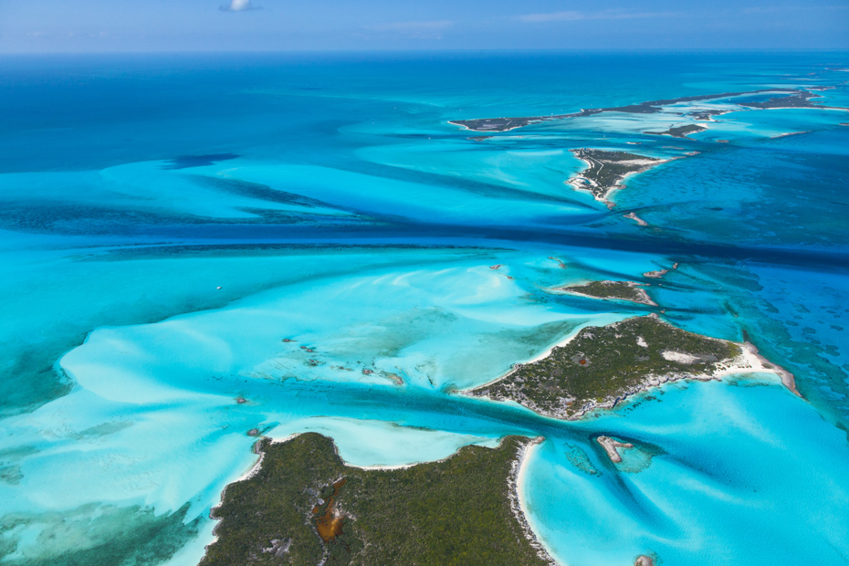 An island paradise awaits in the Bahamas. Shot from a Bahamas air charter on a Bahamas day trip from Miami to see the Bahamas swimming pigs.