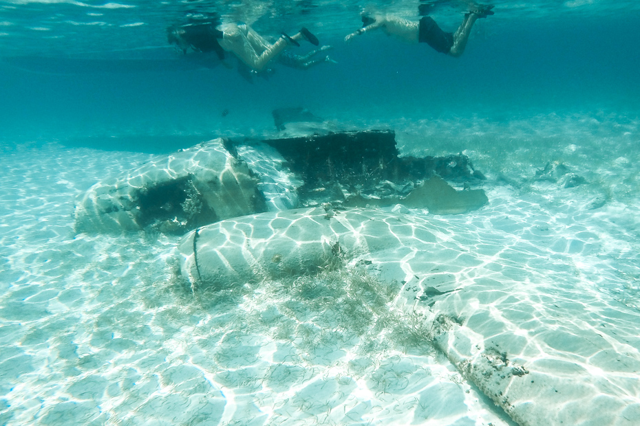 Snorkel at the underwater plane wreck on Exuma Cays Adventures at Staniel Cay Exuma. For the best Exuma excursions from Nassau book a Bahamas Air tours day trip.